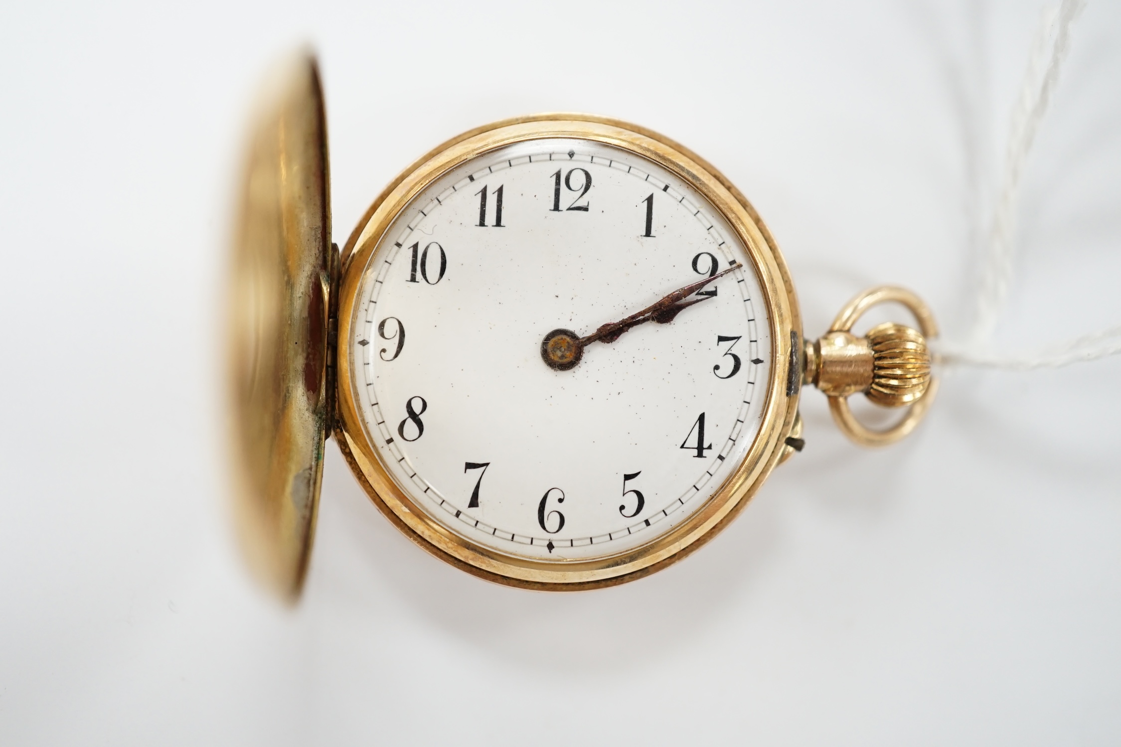 An Edwardian 12ct gold half hunter fob watch, with Arabic dial and Roman chapter ring, gross weight 20.8 grams. Condition - poor